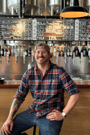 Randy in front of Molo Brew and a huge variety of delicious beers